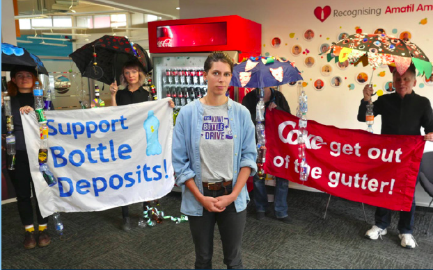 Campaigner Holly Dove and Kiwi Bottle Drive supporters at Coca Cola headquarters to demand action on a CDS.